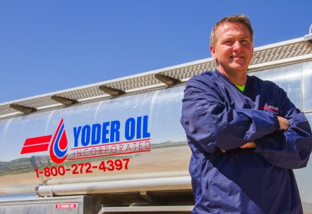 A man standing in front of a Yoder Tanker Truck, used for Propane Delivery Near You